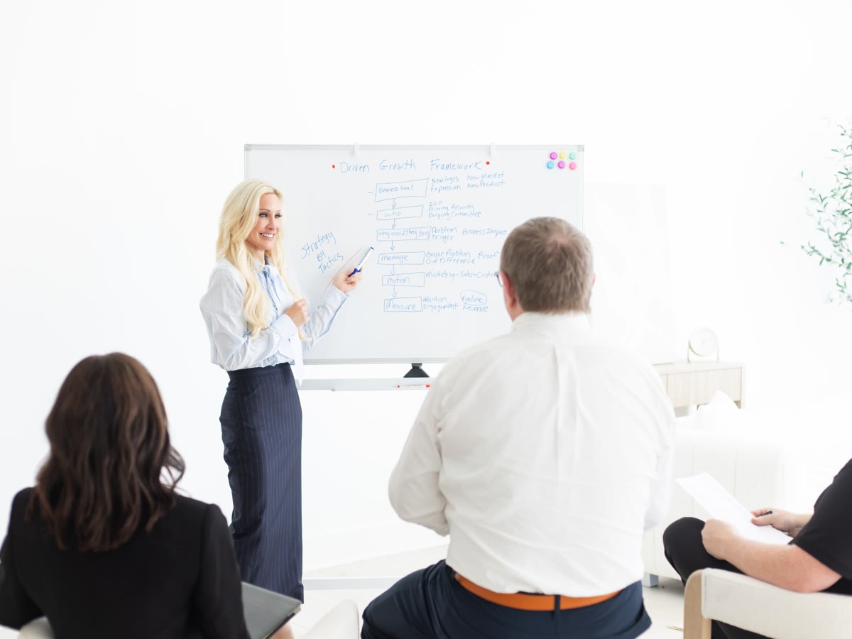 Caroline Lyle leading a strategy workshop at a whiteboard